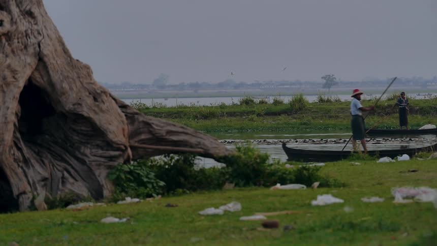A person rowing along in a boat
