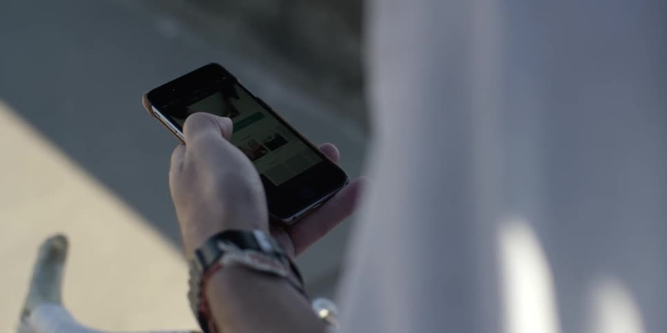 Man scrolling on his phone