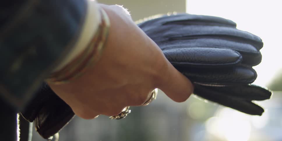 A person holding some gloves