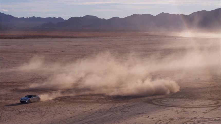 A car drifts on the dirt