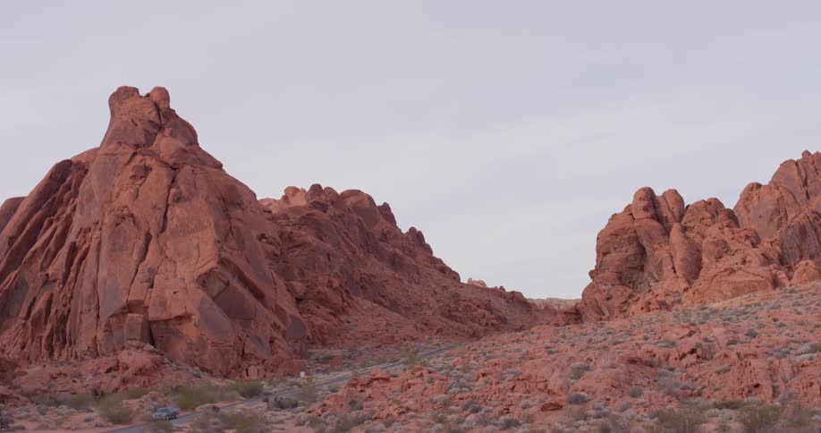 Red rocks cover a desert landscape