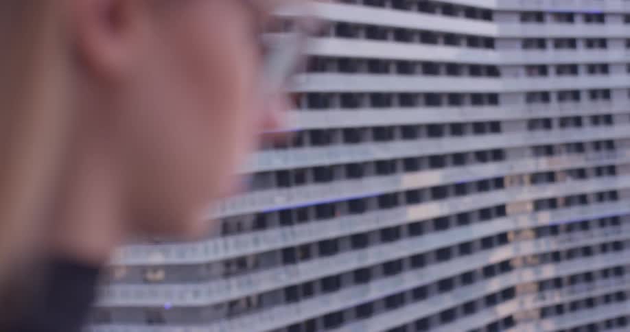 A woman stands out on the balcony