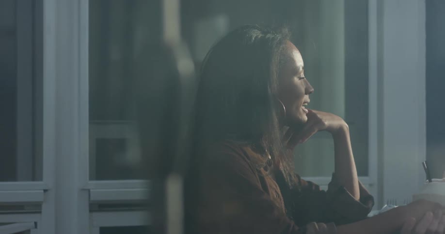 A woman gestures as she talks