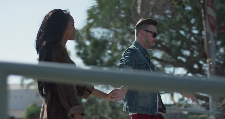 A man and woman dance outside