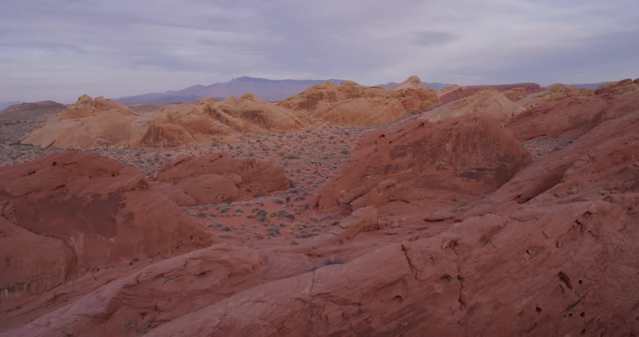 Red rocks cover a desert landscape
