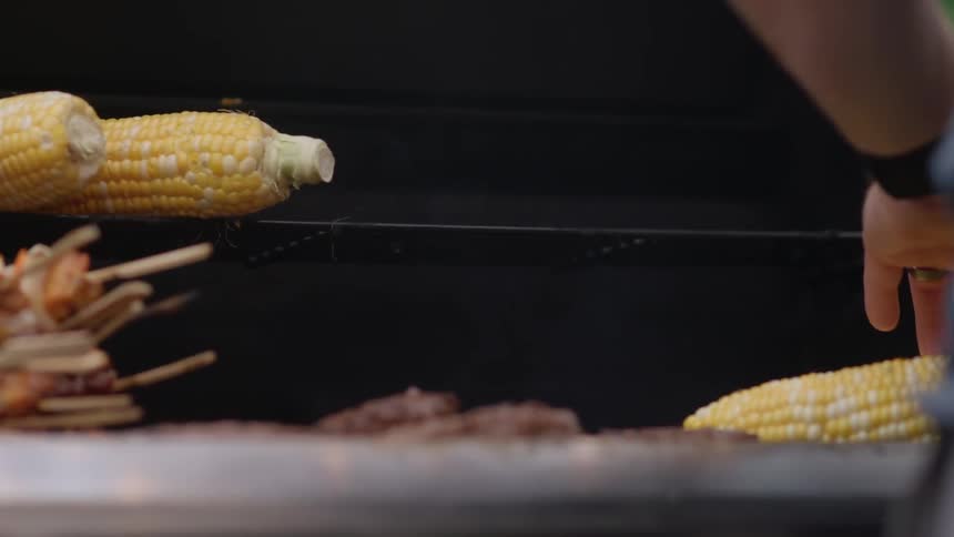 Corn and kabobs being grilled