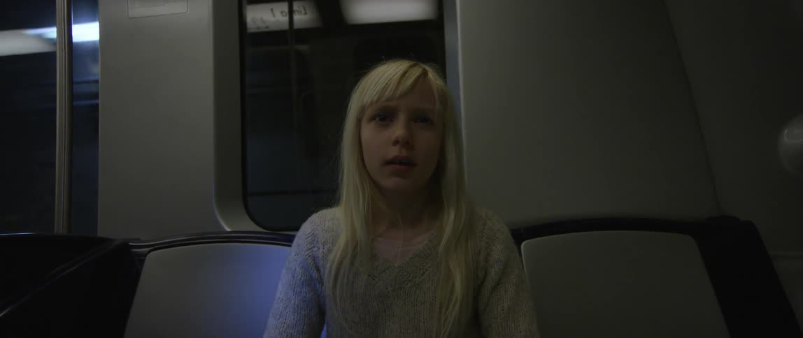 Blonde girl rides the subway