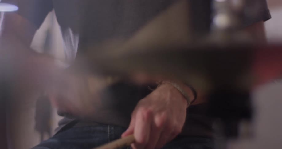 A man plays on the drum set