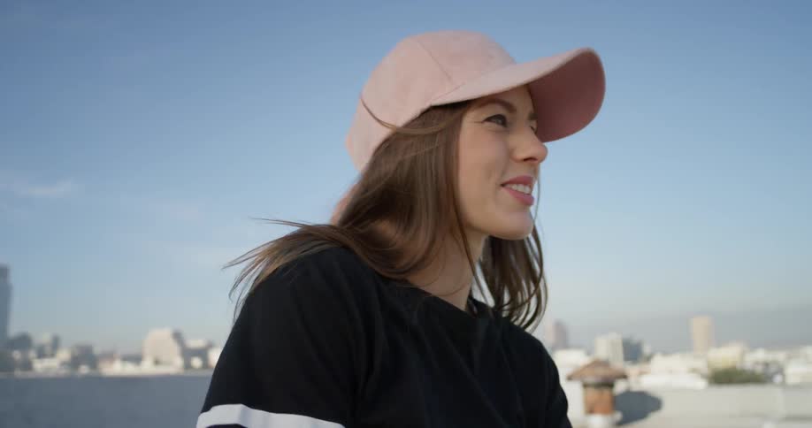 Woman dances on a rooftop in the city