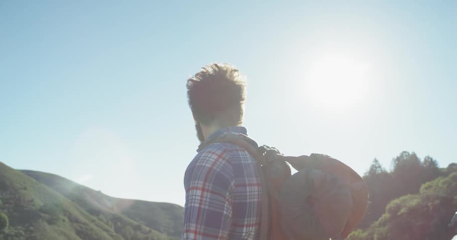 A hiker stops to look around