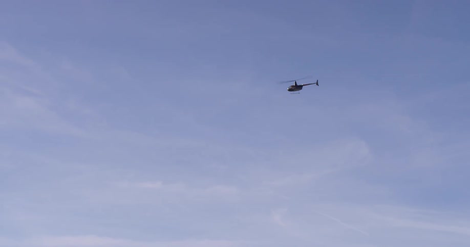 A helicopter flies in the sky