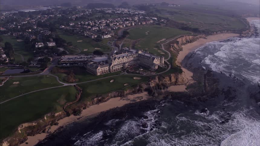 Large majestic castle next to the beach and ocean