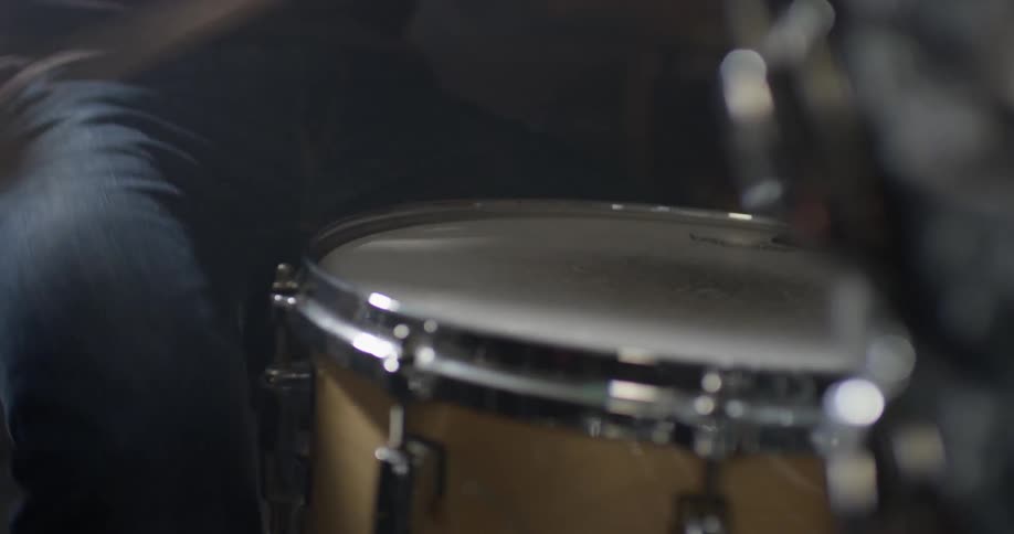A man plays the drums