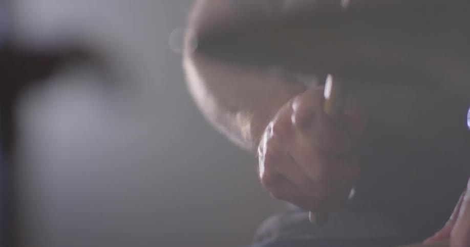 A drummer plays the drums