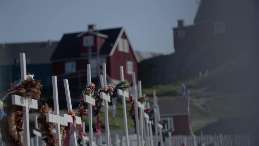 White crosses in a small cemetery in a small village,