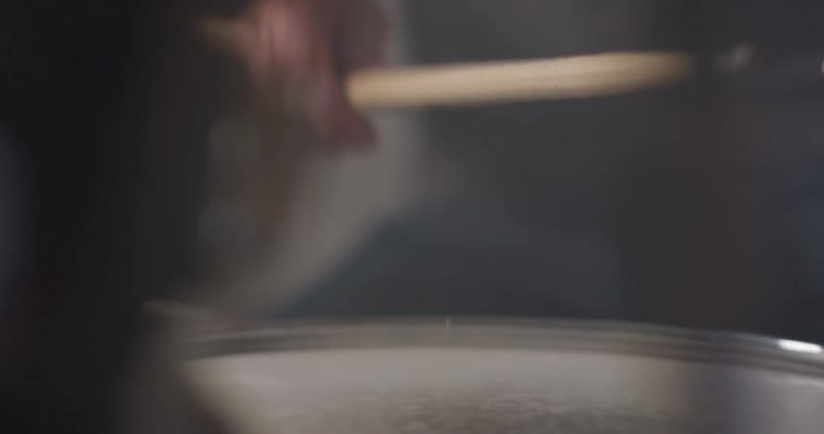 A man grabs drum sticks and taps for the tempo