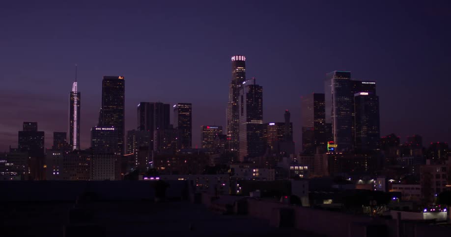 Night is settling over a city skyline