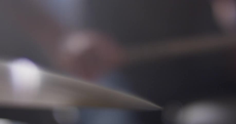 A man plays the drums