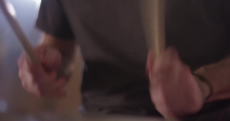 A man plays the drums