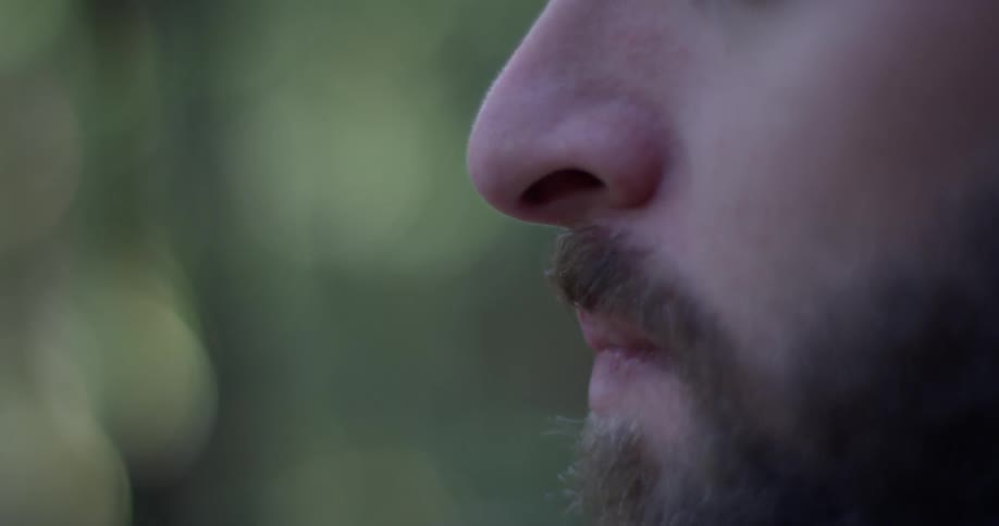 A hiker takes a sip from a water bottle