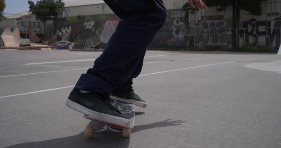 A skateboarder performs a jumping trick