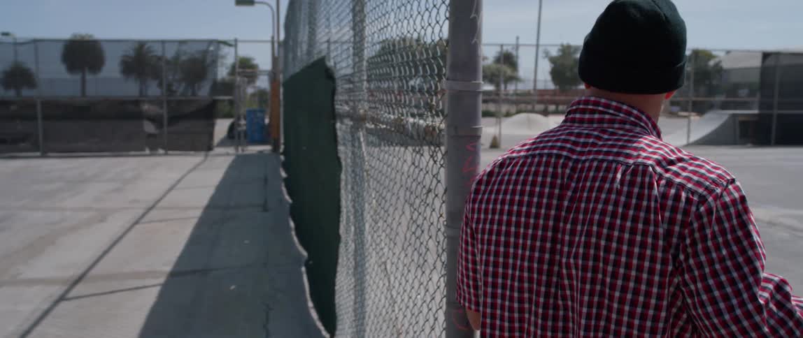 A man walks onto the skate park