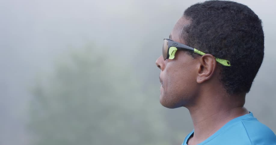 A man looks out into the fog