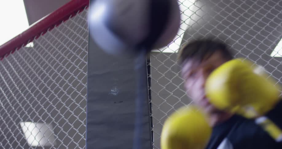 A man trains on a punching bag