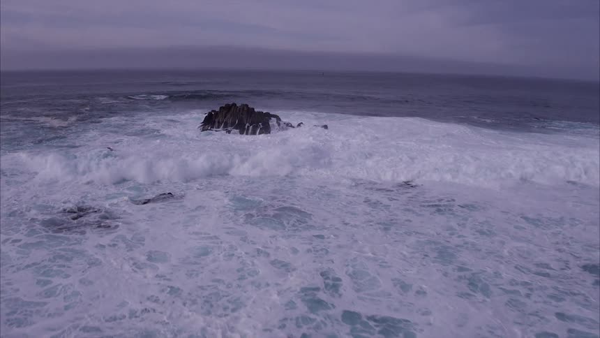 The coast has rough waves at dawn