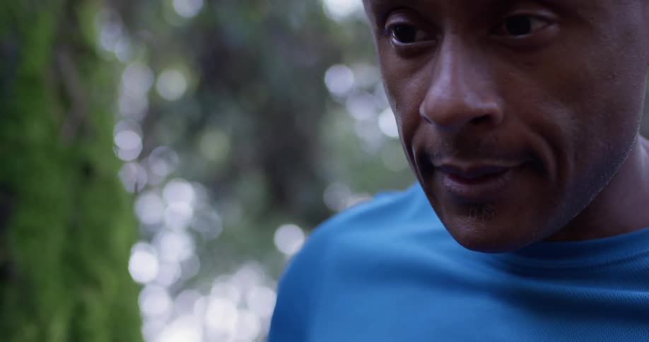 A man catches his breath outside before jogging off