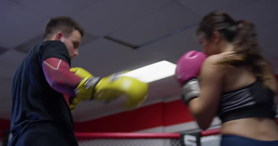 A man and woman box together