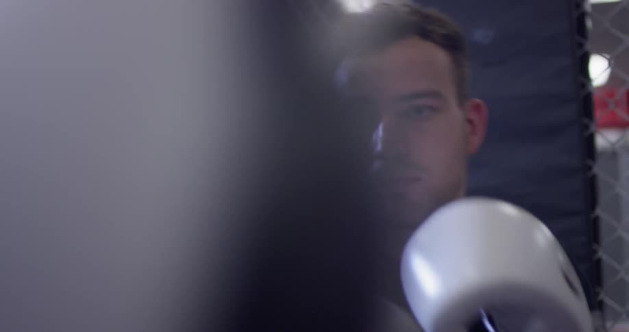 A man trains on a punching bag