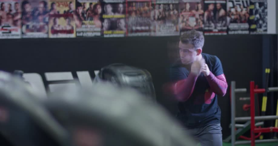 A man trains by throwing punches