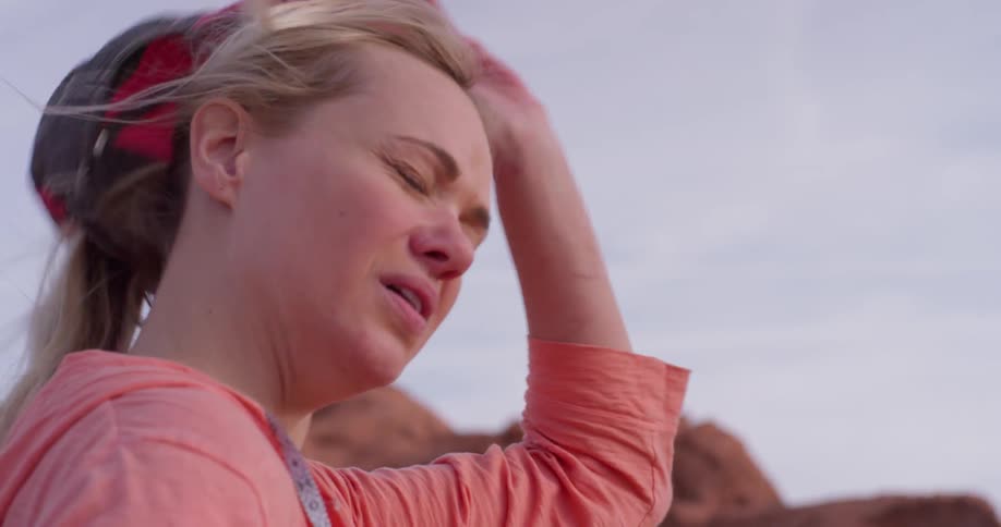 A woman hikes in a desert