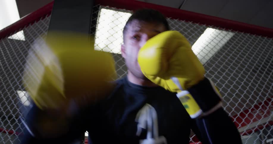 A man trains on a punching bag
