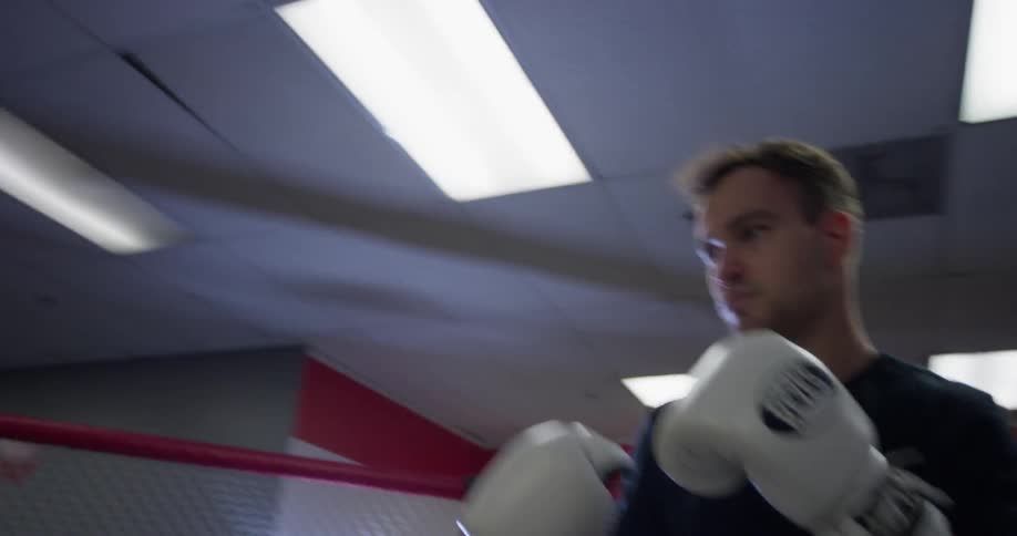 Two men train in an mma ring