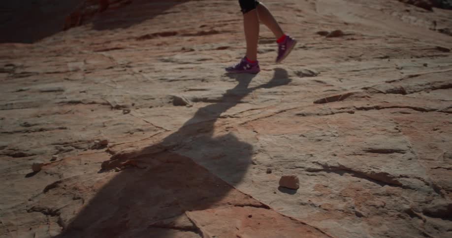 Person walks on rocky terrain