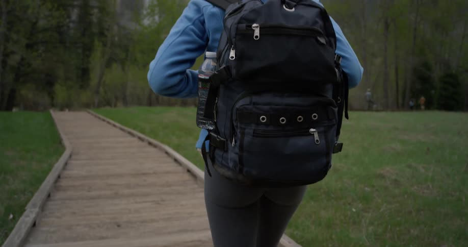 A woman hikes in mountains