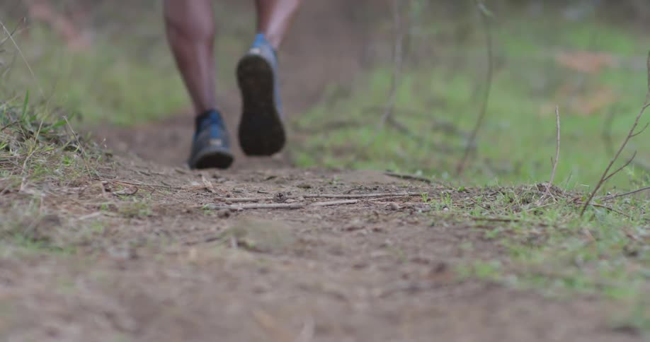 A person is jogging uphill