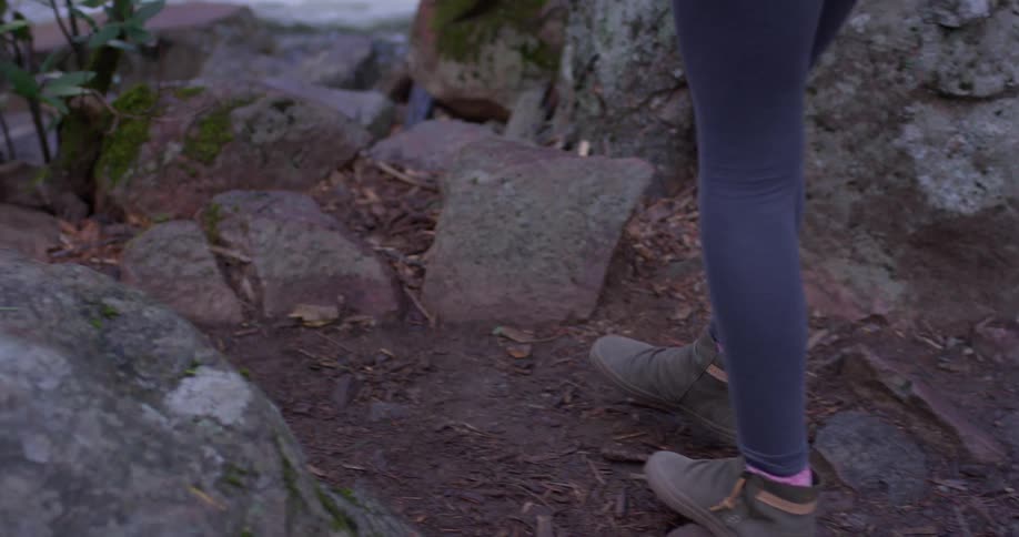 A woman hikes near the river