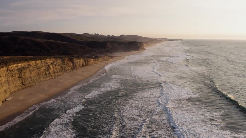 The tide flows onto the shore