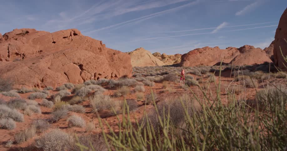 The person jogs over the desert
