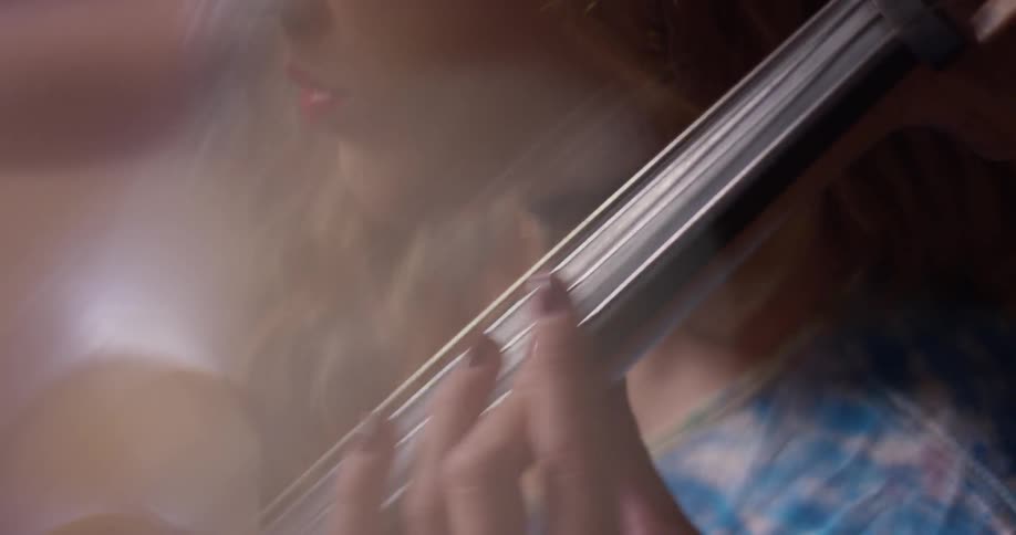 A woman plays a cello