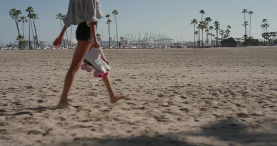 Woman Rollerblading Around Beach