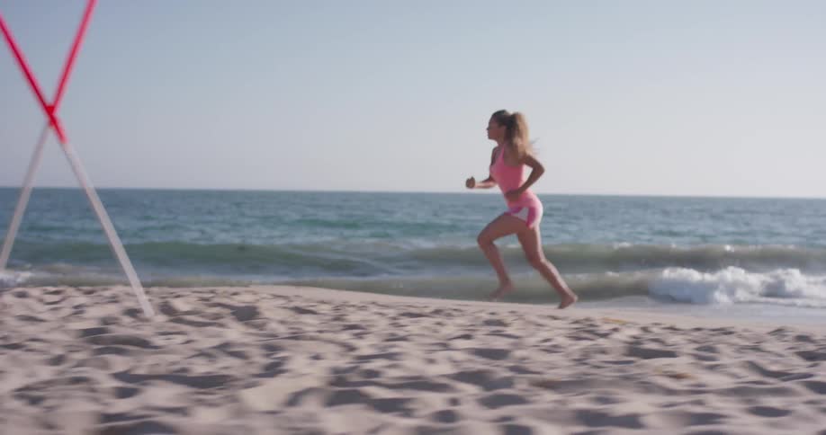 A woman is running on the beach