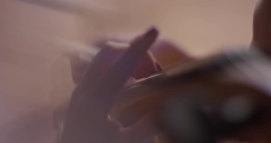 The woman presses the cords on the double bass