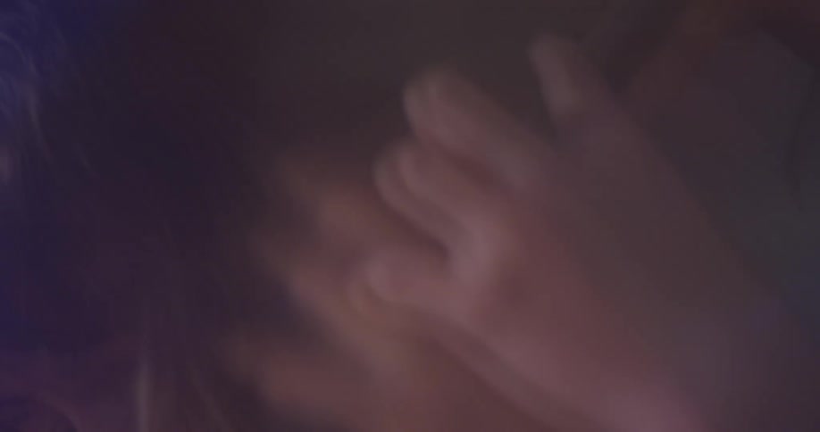 Woman plays the cello and nods her head
