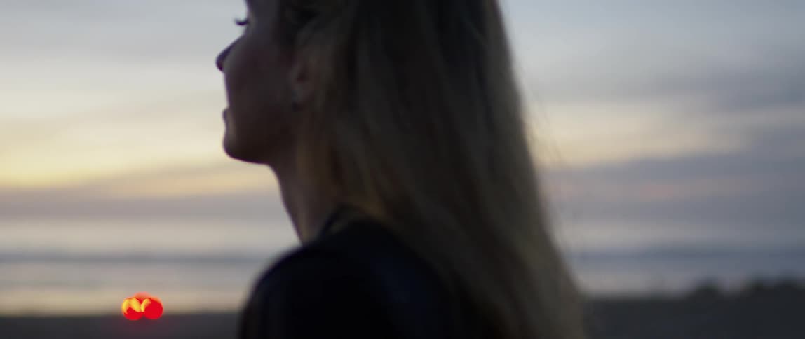 Woman Watching Sunset At Beach