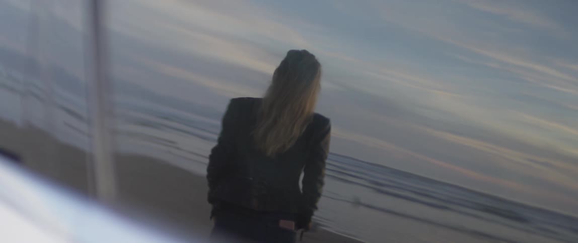 Woman Watching Sunset At Beach