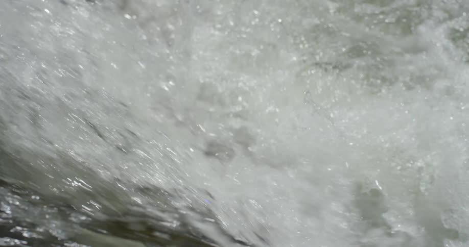 The ocean water flows and splashes